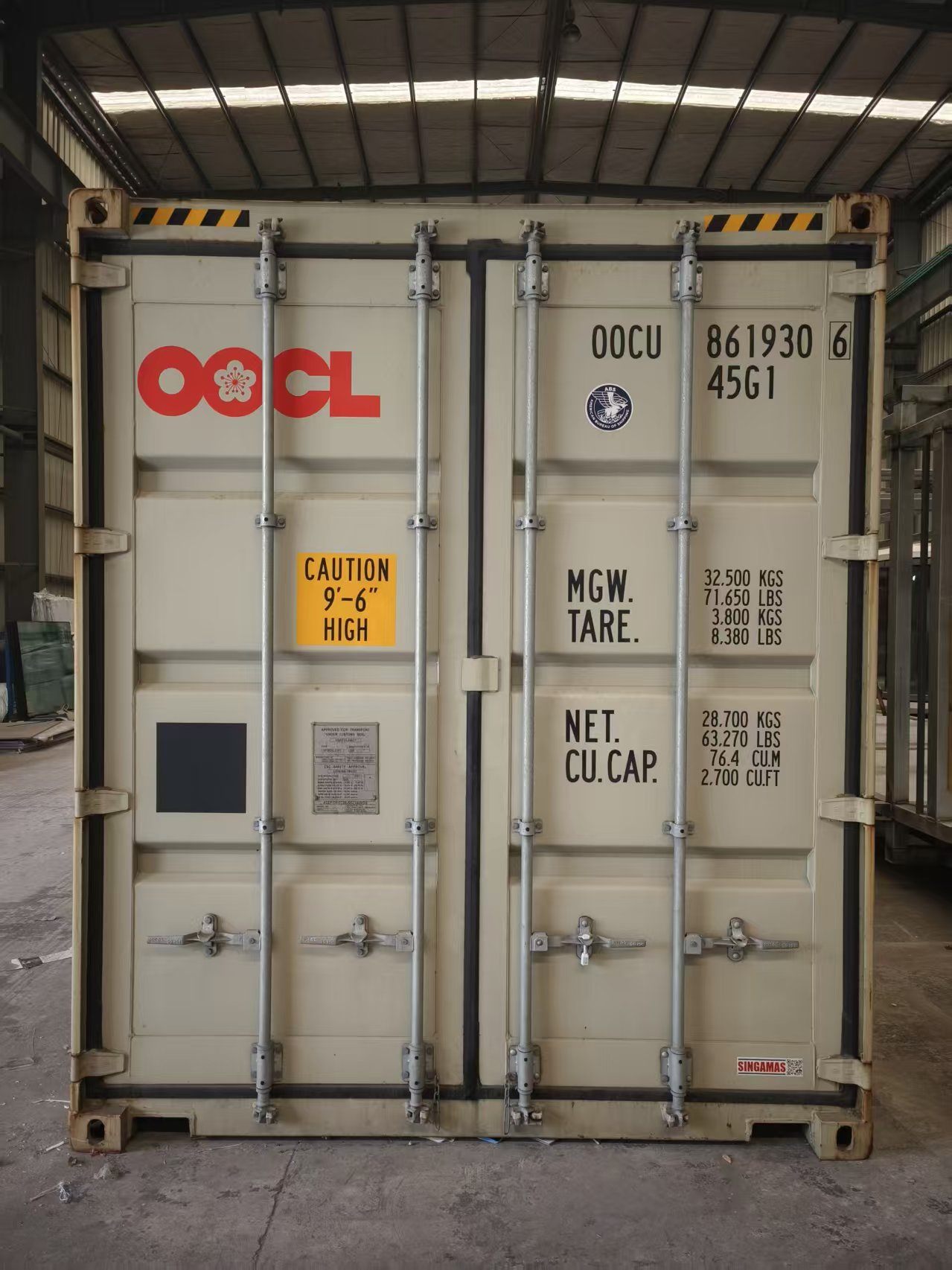 Container door showing prefab cabin shipment preparation